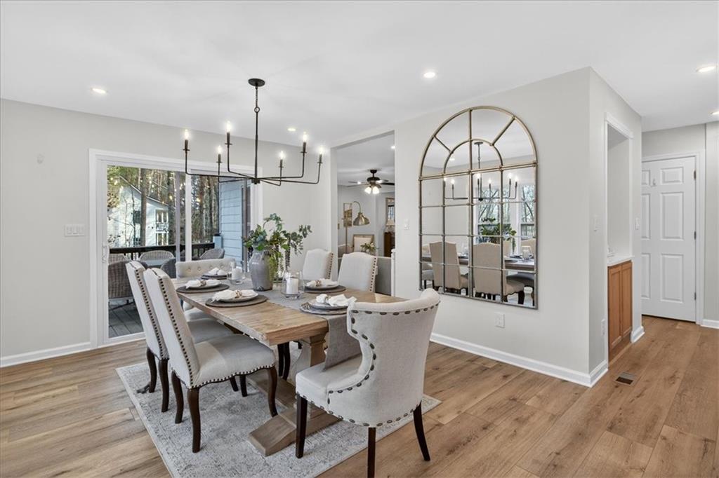 16145 Henderson Road Alpharetta, GA 30004 - Photo 17 of 61 a view of a dining room with furniture window and wooden floor