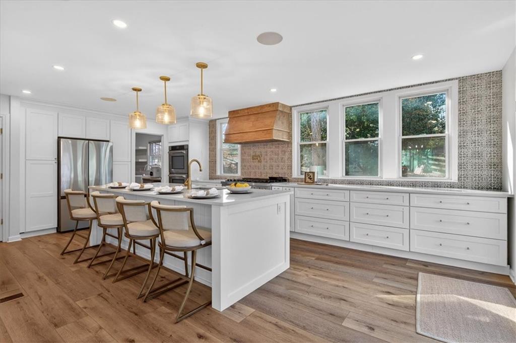 16145 Henderson Road Alpharetta, GA 30004 - Photo 18 of 61 a kitchen with counter space cabinets and appliances