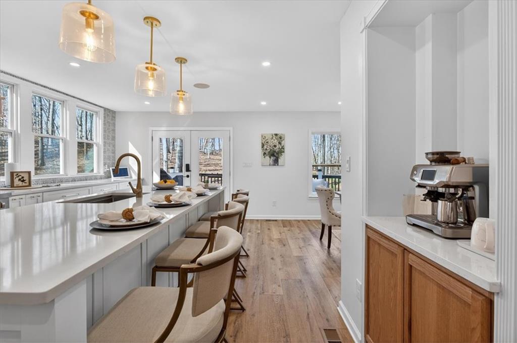 16145 Henderson Road Alpharetta, GA 30004 - Photo 23 of 61 a kitchen with sink refrigerator and cabinets