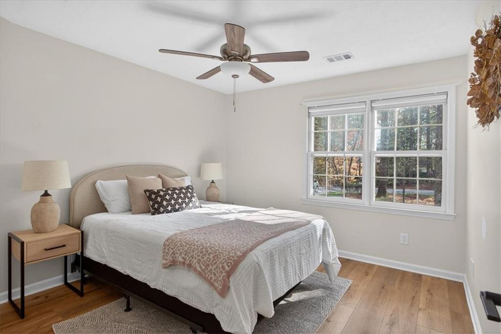 16145 Henderson Road Alpharetta, GA 30004 - Photo 37 of 61 a bedroom with a bed and window