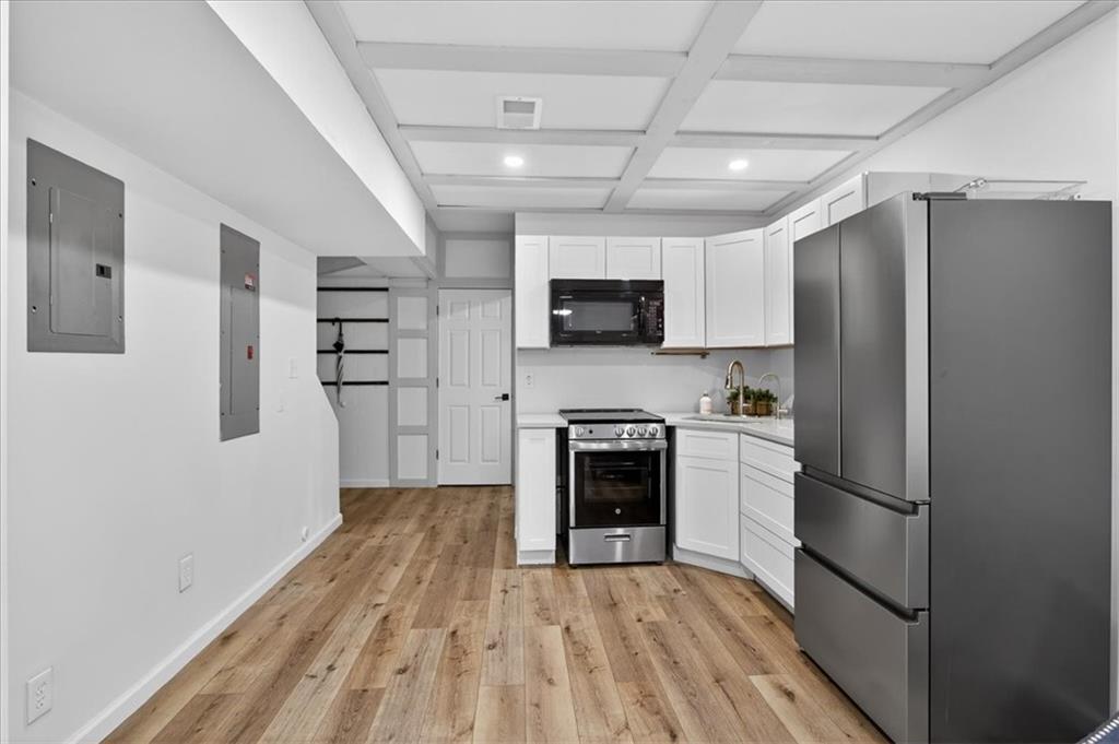 16145 Henderson Road Alpharetta, GA 30004 - Photo 44 of 61 a kitchen with granite countertop a refrigerator oven a stove top oven a sink and dishwasher