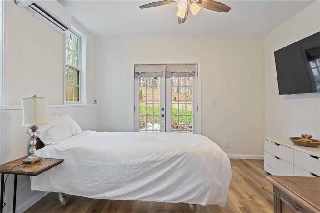 16145 Henderson Road Alpharetta, GA 30004 - Photo 45 of 61 a bedroom with a bed and a tv