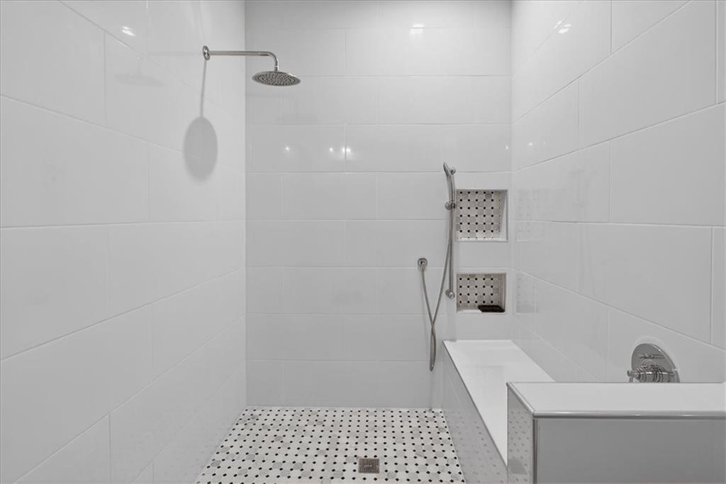 16145 Henderson Road Alpharetta, GA 30004 - Photo 48 of 61 a bathroom with a sink a toilet a shower and a mirror