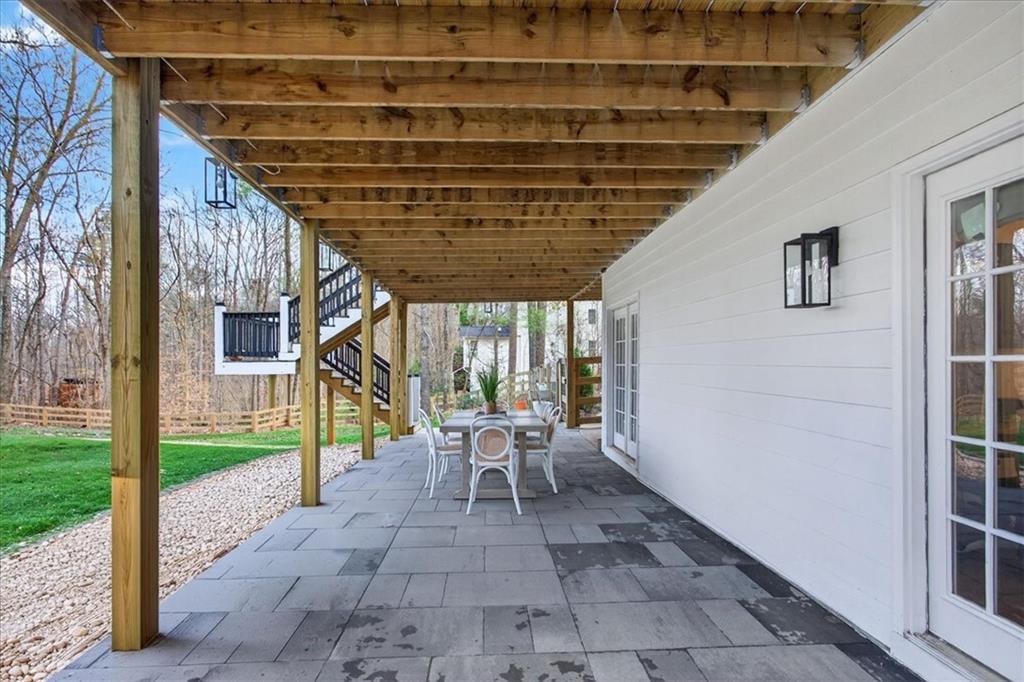 16145 Henderson Road Alpharetta, GA 30004 - Photo 52 of 61 a view of a porch with chairs and backyard