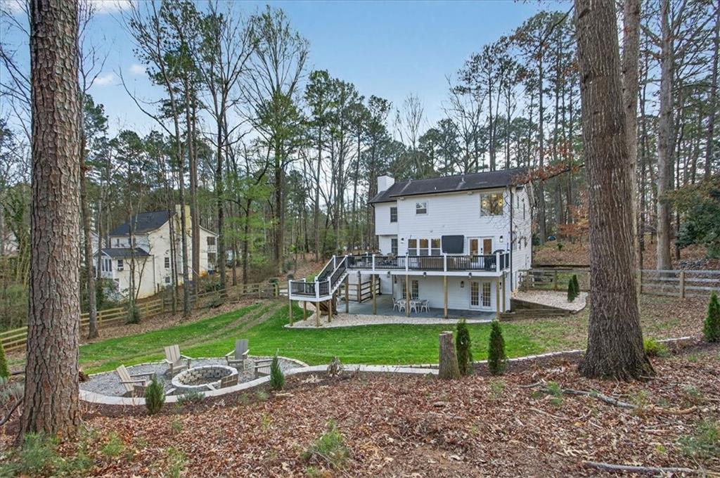 16145 Henderson Road Alpharetta, GA 30004 - Photo 54 of 61 a view of a chair and table in backyard of the house