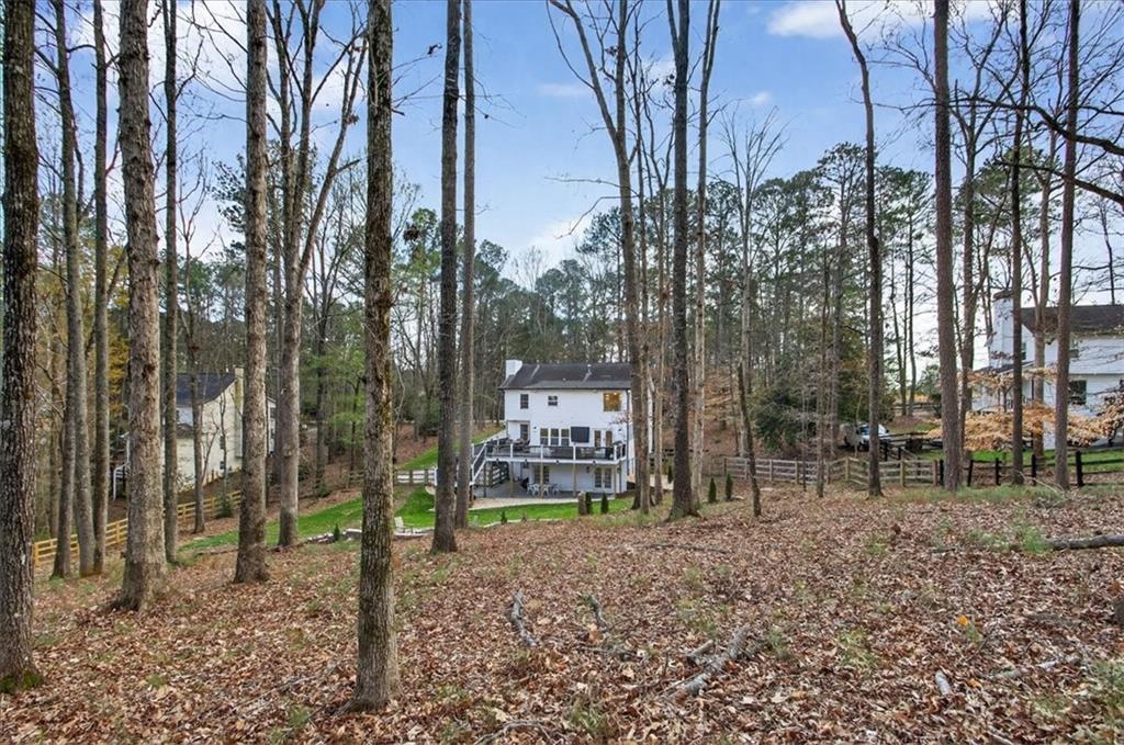 16145 Henderson Road Alpharetta, GA 30004 - Photo 56 of 61 a backyard of a house with lots of green space