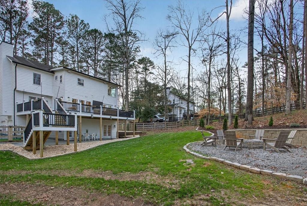 16145 Henderson Road Alpharetta, GA 30004 - Photo 57 of 61 a view of a house with backyard and a slide