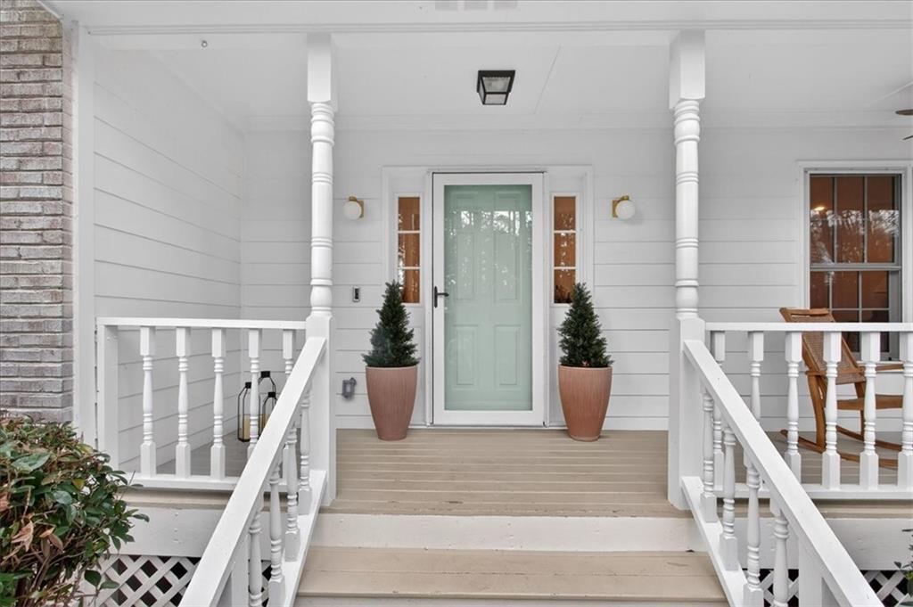 16145 Henderson Road Alpharetta, GA 30004 - Photo 7 of 61 a view of entryway with wooden floor and stairs