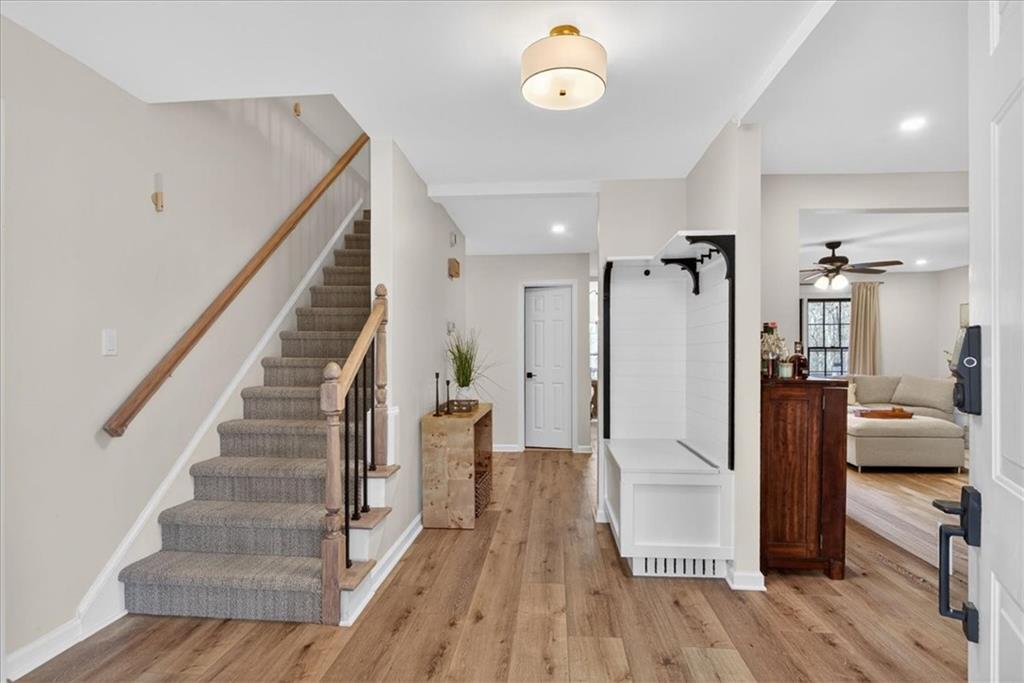 16145 Henderson Road Alpharetta, GA 30004 - Photo 9 of 61 a view of a hallway view with wooden floor and staircase