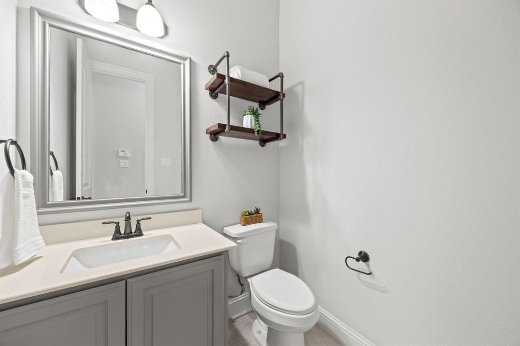 1109 Rendon Place Mansfield, TX 76063 - Photo 19 of 33 a bathroom with a granite countertop sink toilet and mirror