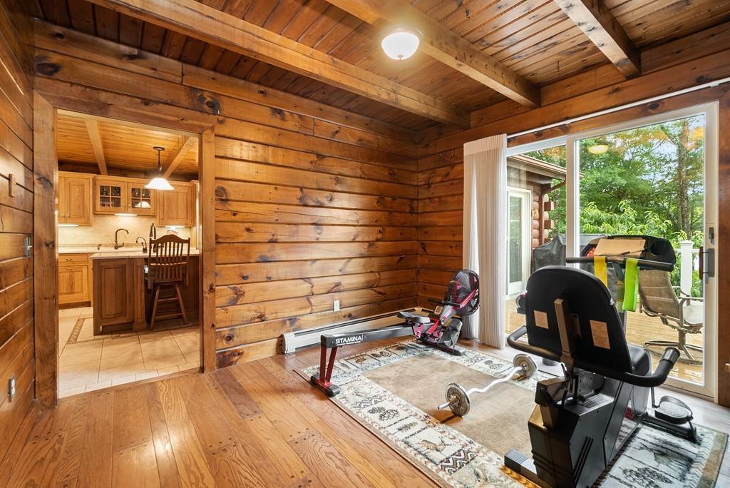 24 Ridge Trail Douglas, MA 01516 - Photo 16 of 36 a roof deck with table and chairs a barbeque with wooden floor and plants