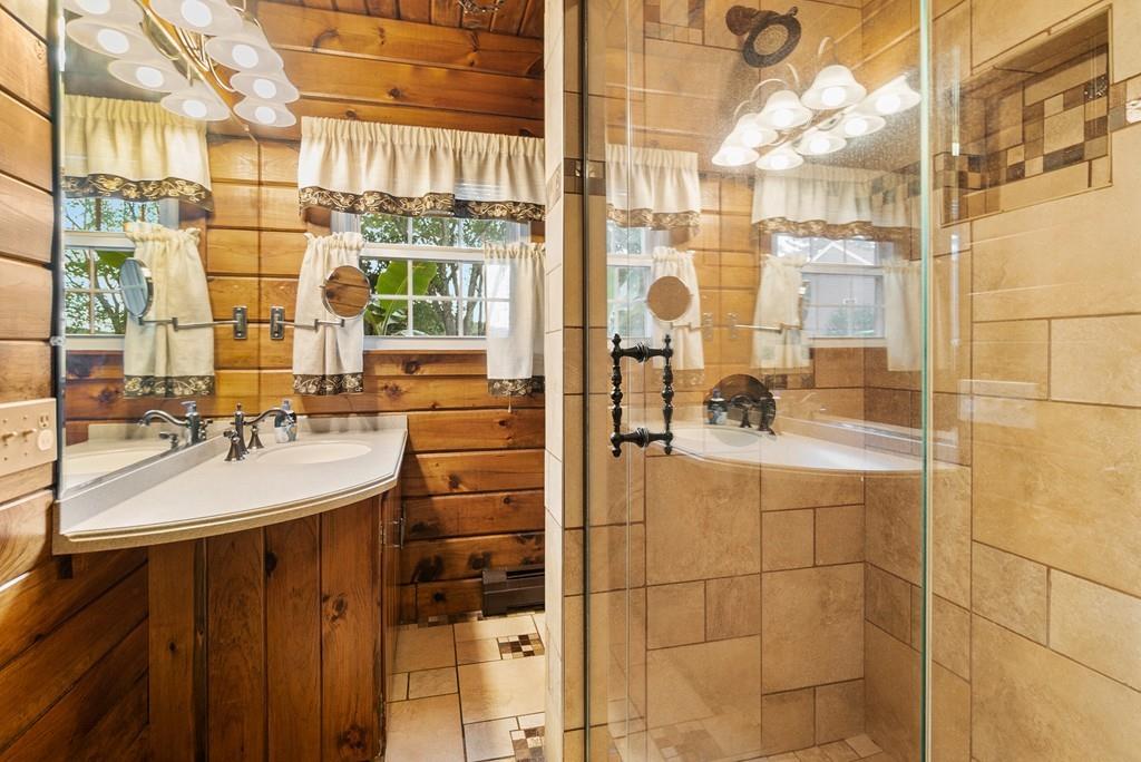 24 Ridge Trail Douglas, MA 01516 - Photo 17 of 36 a bathroom with a sink and a mirror
