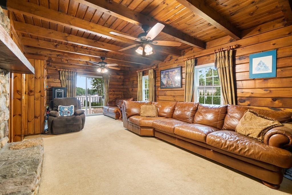 24 Ridge Trail Douglas, MA 01516 - Photo 21 of 36 a living room with furniture a large window and a chandelier