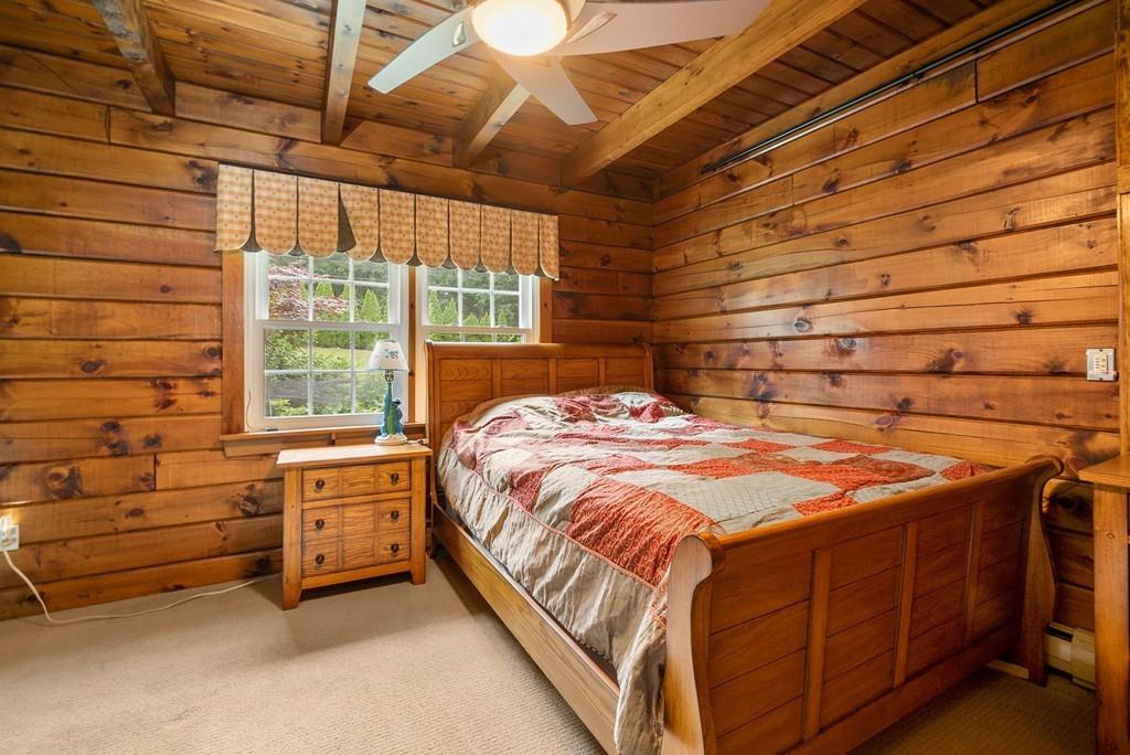 24 Ridge Trail Douglas, MA 01516 - Photo 23 of 36 a bed sitting in a room next to a window