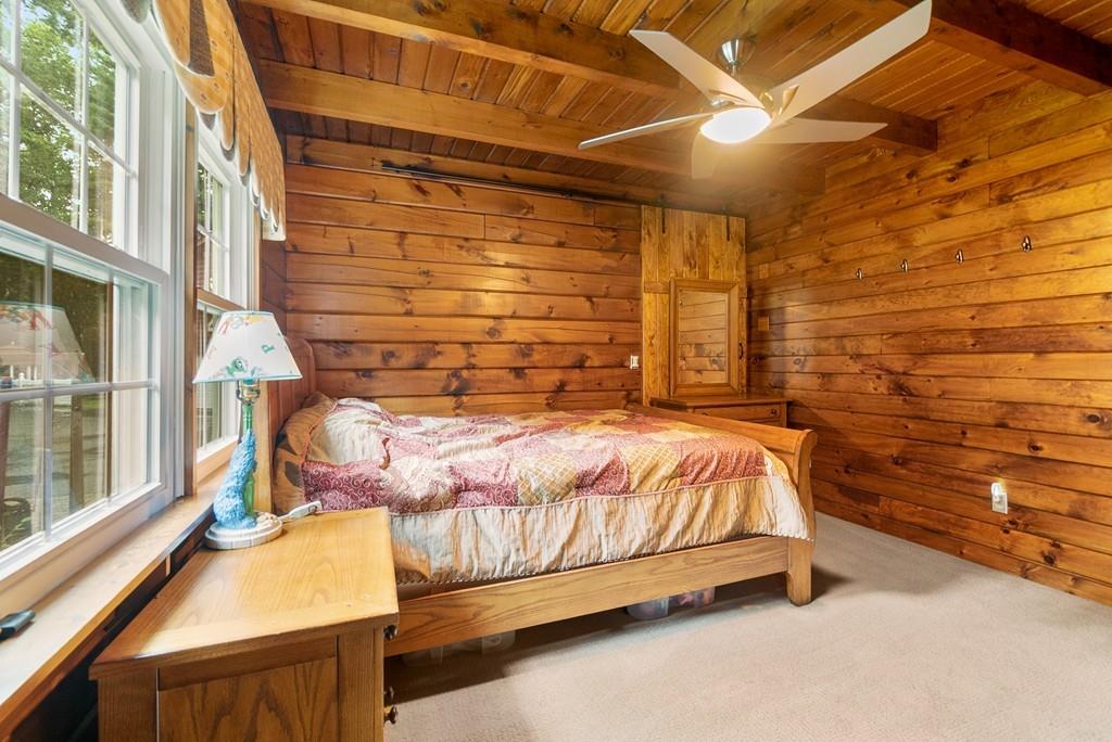 24 Ridge Trail Douglas, MA 01516 - Photo 24 of 36 a bed sitting in a bedroom next to a window