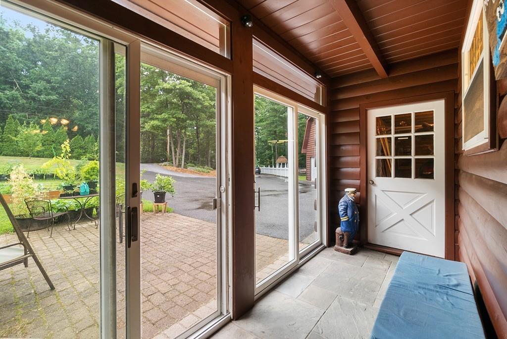 24 Ridge Trail Douglas, MA 01516 - Photo 28 of 36 a view of a porch with wooden floor and outer view