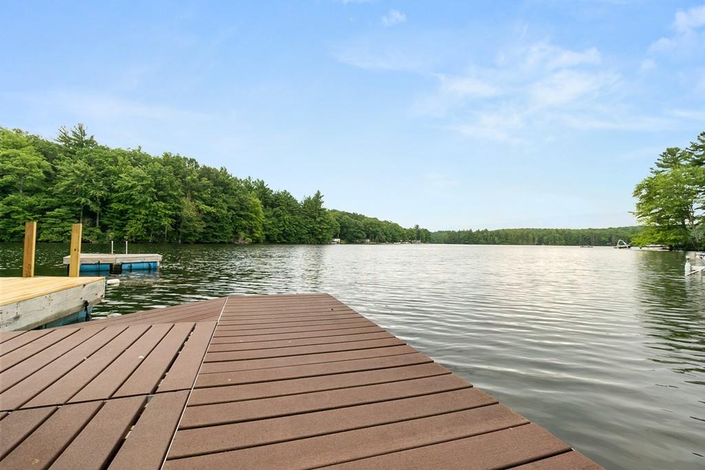 24 Ridge Trail Douglas, MA 01516 - Photo 30 of 36 a view of a lake with wooden floor and lake view