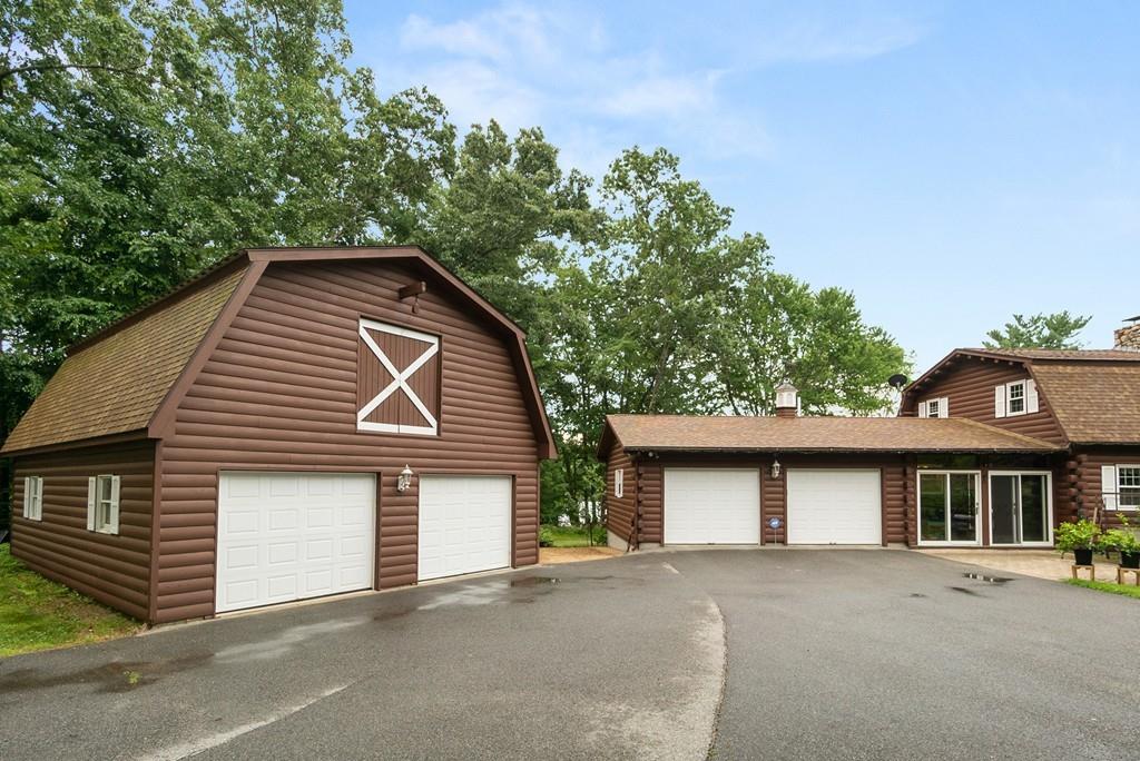 24 Ridge Trail Douglas, MA 01516 - Photo 35 of 36 a front view of a house with a garage