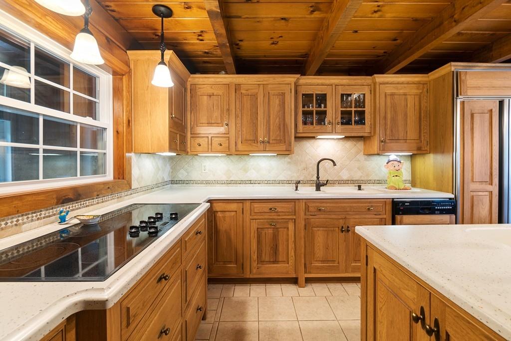 24 Ridge Trail Douglas, MA 01516 - Photo 8 of 36 a kitchen with stainless steel appliances granite countertop a stove sink and cabinets