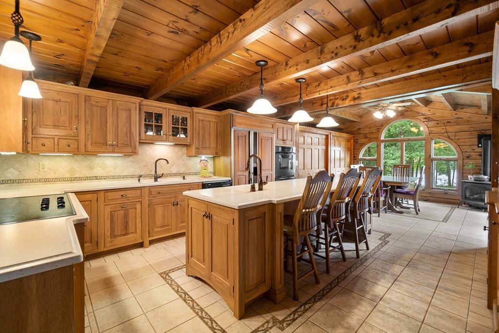 24 Ridge Trail Douglas, MA 01516 - Photo 9 of 36 a kitchen with a sink and cabinets