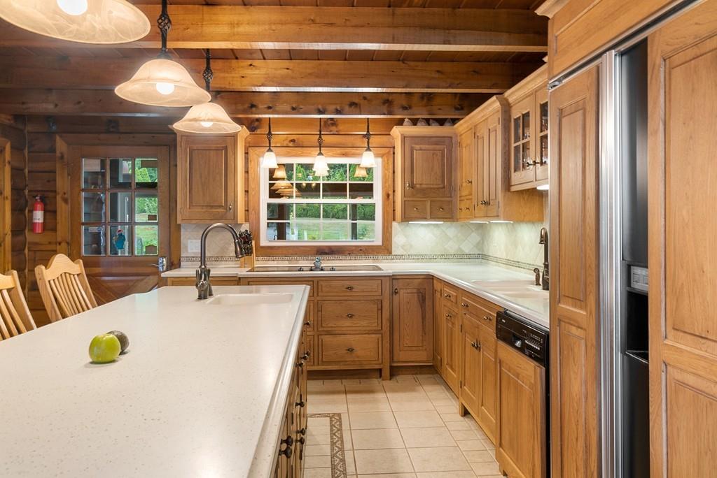 24 Ridge Trail Douglas, MA 01516 - Photo 10 of 36 a large white kitchen with a large window