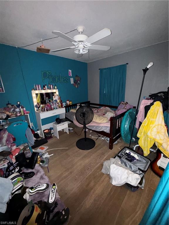 117 Robert Avenue Lehigh Acres, FL 33936 - Photo 11 of 20 Bedroom with a ceiling fan and wood finished floors