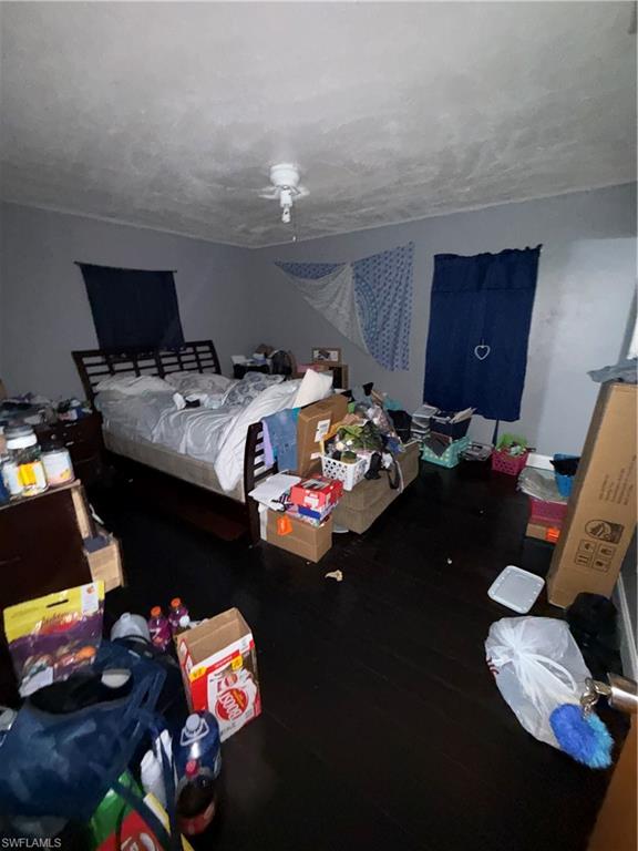 117 Robert Avenue Lehigh Acres, FL 33936 - Photo 8 of 20 Bedroom featuring wood finished floors