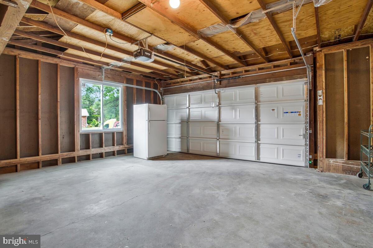 13006 Claxton Drive Laurel, MD 20708 - Photo 36 of 46 Spacious 2 car Garage w/ 2nd Refrigerator