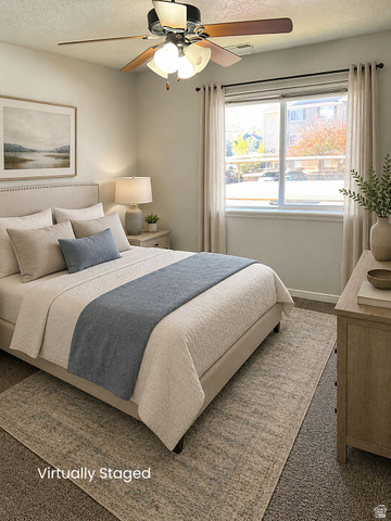 8198 North Cedar Springs Road, Unit T6 Eagle Mountain, UT 84005 - Photo 5 of 13 Bedroom featuring a ceiling fan with integrated lighting, a large window with blinds, and neutral-toned wall-to-wall carpeting