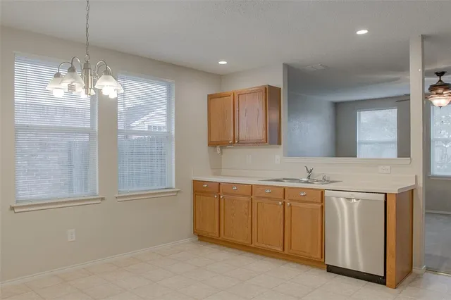 a view of a kitchen center island and windows