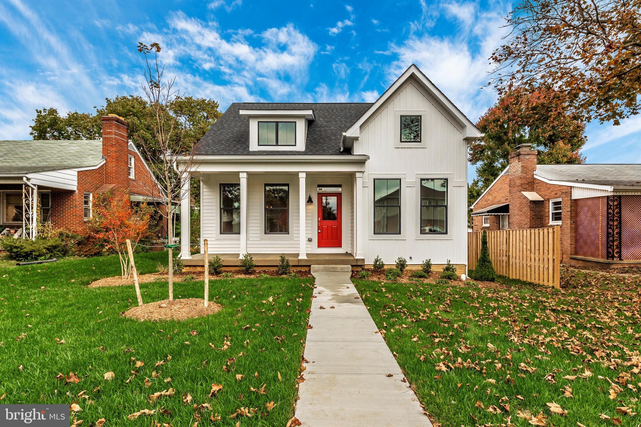 215 Central Avenue Gaithersburg, MD 20877 - Photo 1 of 54 a front view of a house with a yard