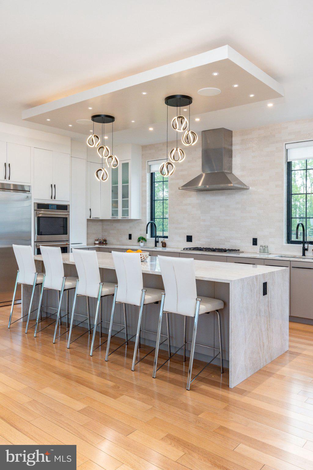 9739 Krewstown Road Philadelphia, PA 19115 - Photo 23 of 84 Sleek modern kitchen with elegant lighting.