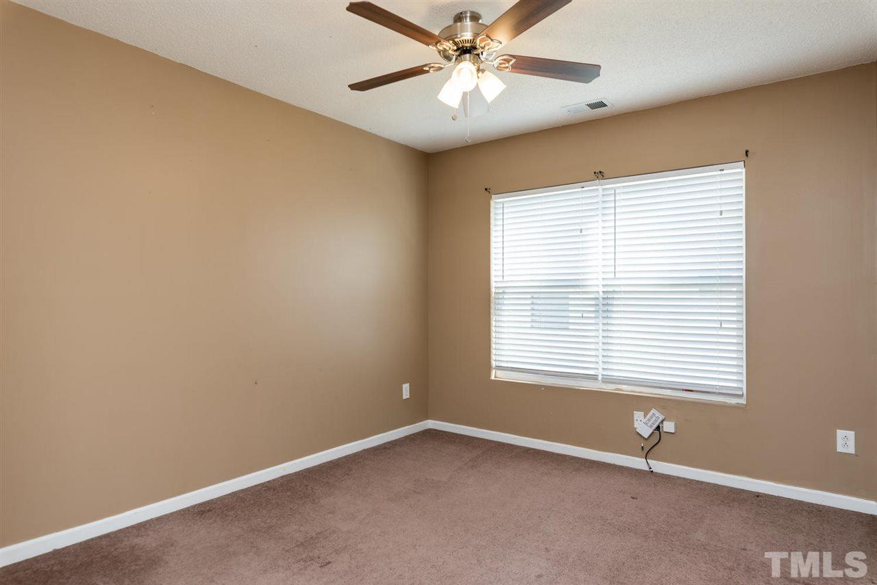3670 Marshlane Way Raleigh, NC 27610 - Photo 15 of 22 a view of an empty room with a window
