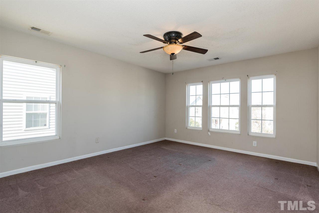 3670 Marshlane Way Raleigh, NC 27610 - Photo 16 of 22 a view of an empty room with a window
