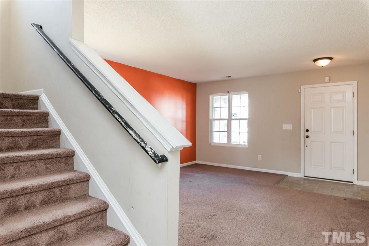3670 Marshlane Way Raleigh, NC 27610 - Photo 3 of 22 a view of entryway and hall with wooden floor