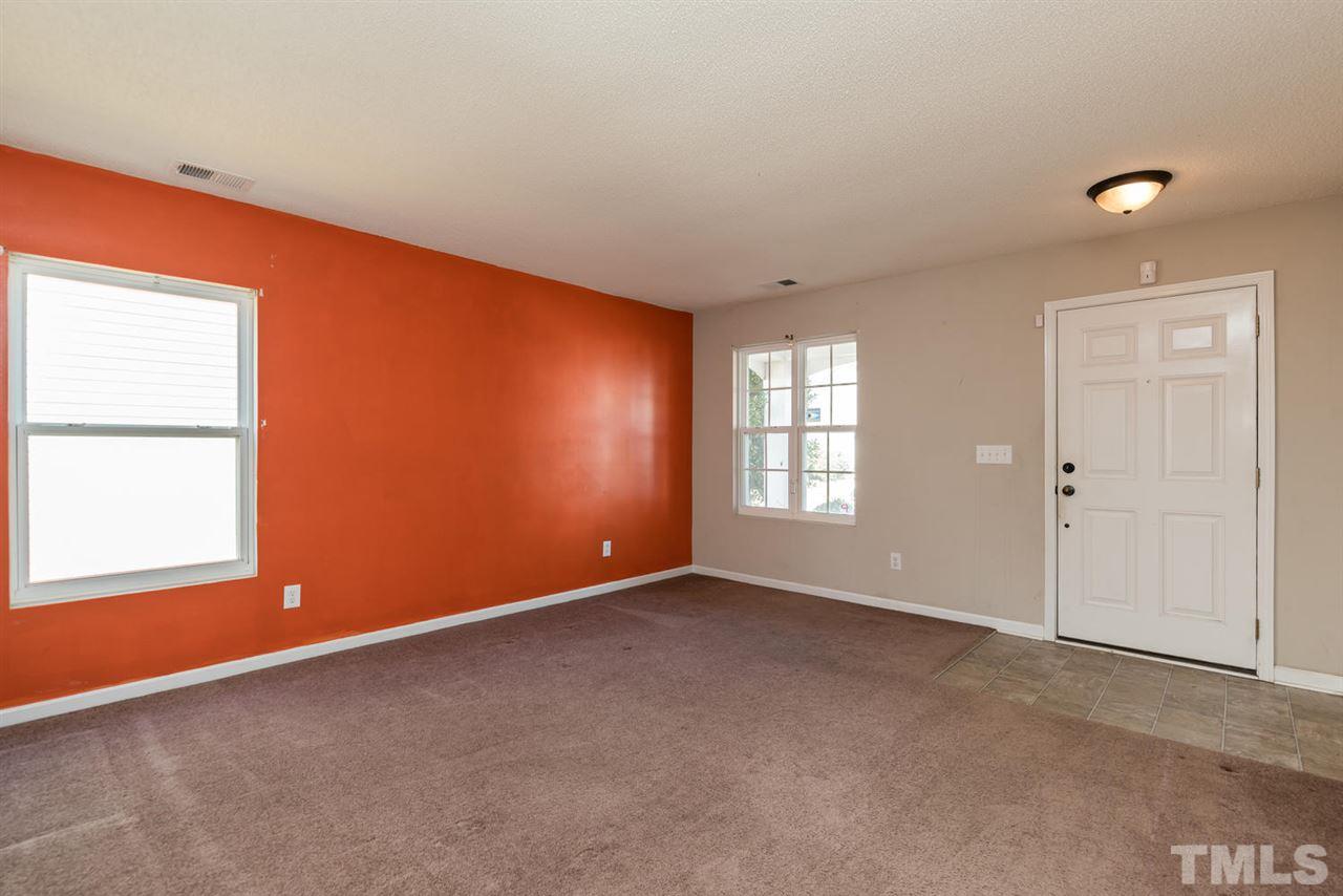 3670 Marshlane Way Raleigh, NC 27610 - Photo 4 of 22 an empty room with windows