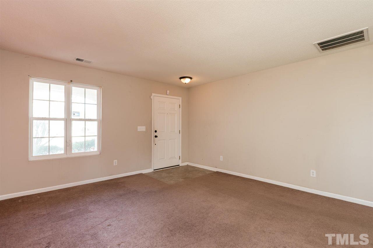 3670 Marshlane Way Raleigh, NC 27610 - Photo 5 of 22 an empty room with windows