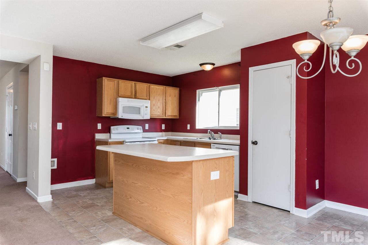 3670 Marshlane Way Raleigh, NC 27610 - Photo 10 of 22 a view of a kitchen with a sink and a refrigerator