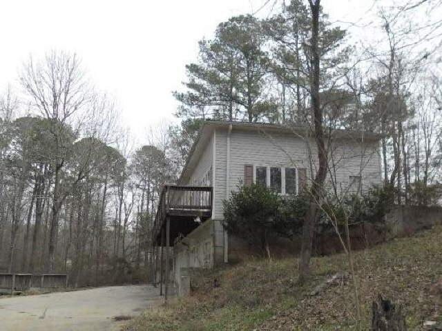 585 Hollonville Road Brooks, GA 30205 - Photo 1 of 1 a backyard of a house with plants and trees