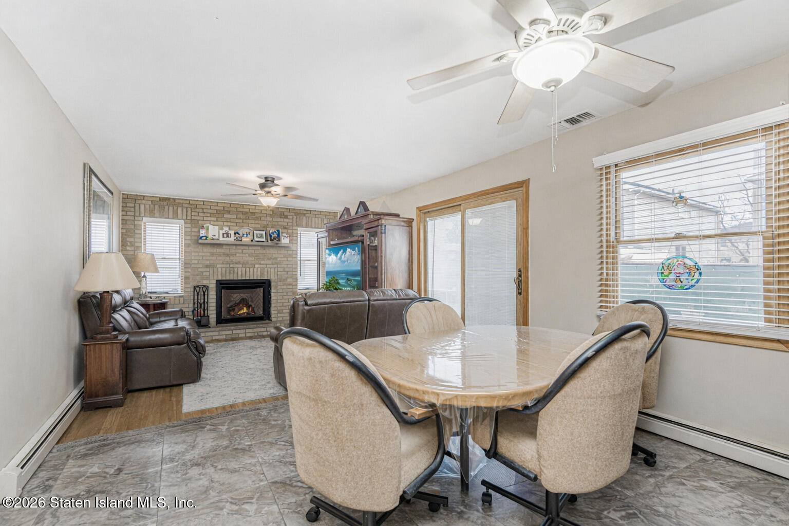 471 Main Street Staten Island, NY 10307 - Photo 11 of 39 a living room with furniture and a fireplace