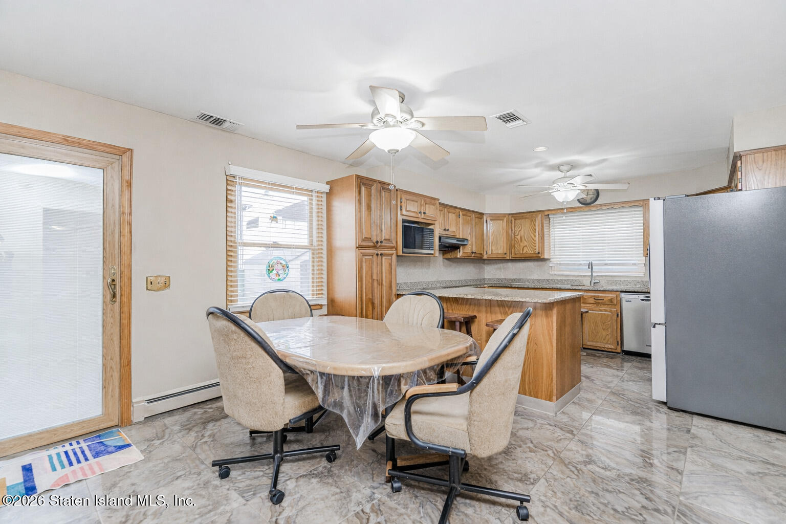 471 Main Street Staten Island, NY 10307 - Photo 12 of 39 a dining room with furniture and window
