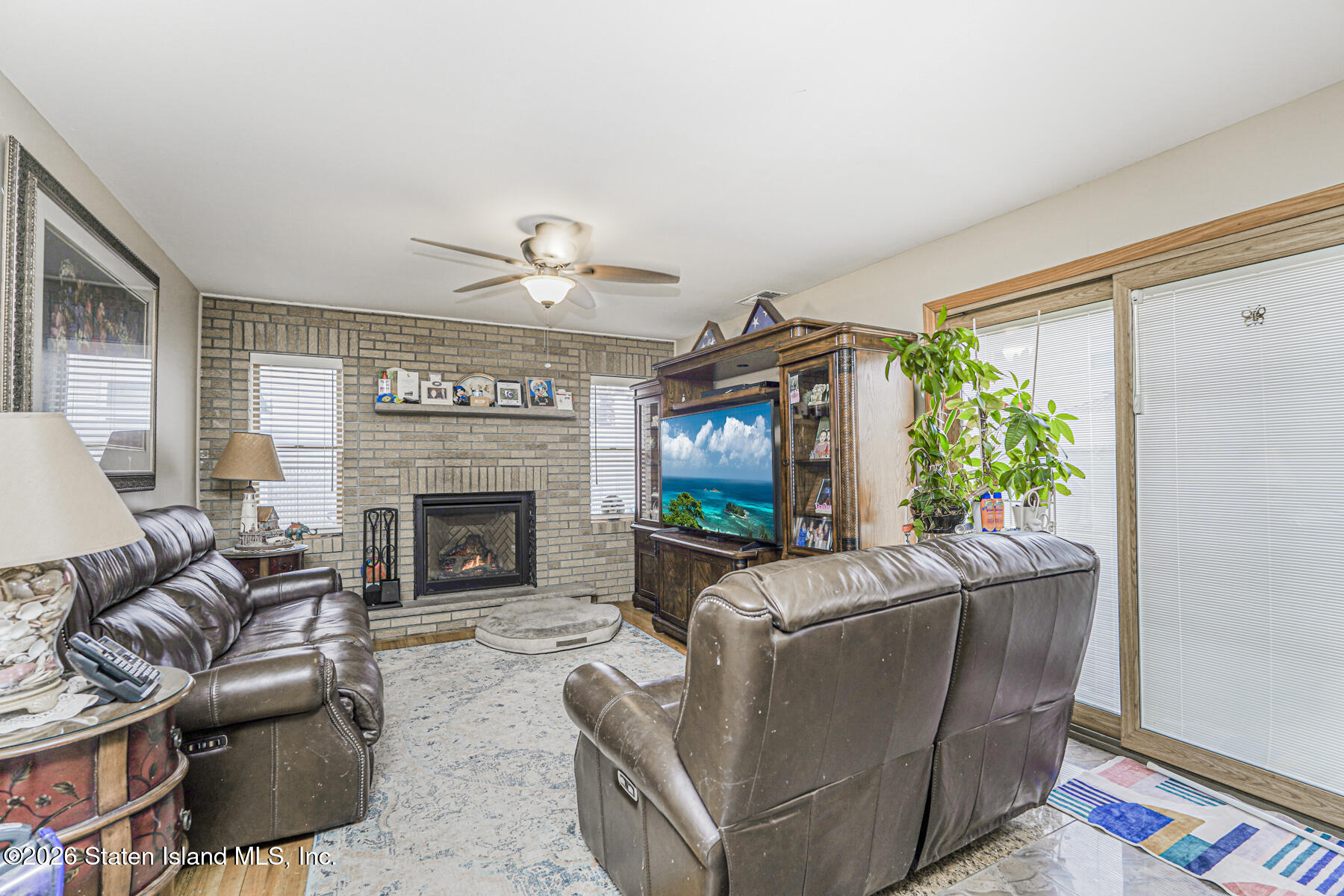 471 Main Street Staten Island, NY 10307 - Photo 18 of 39 a living room with furniture and a fireplace