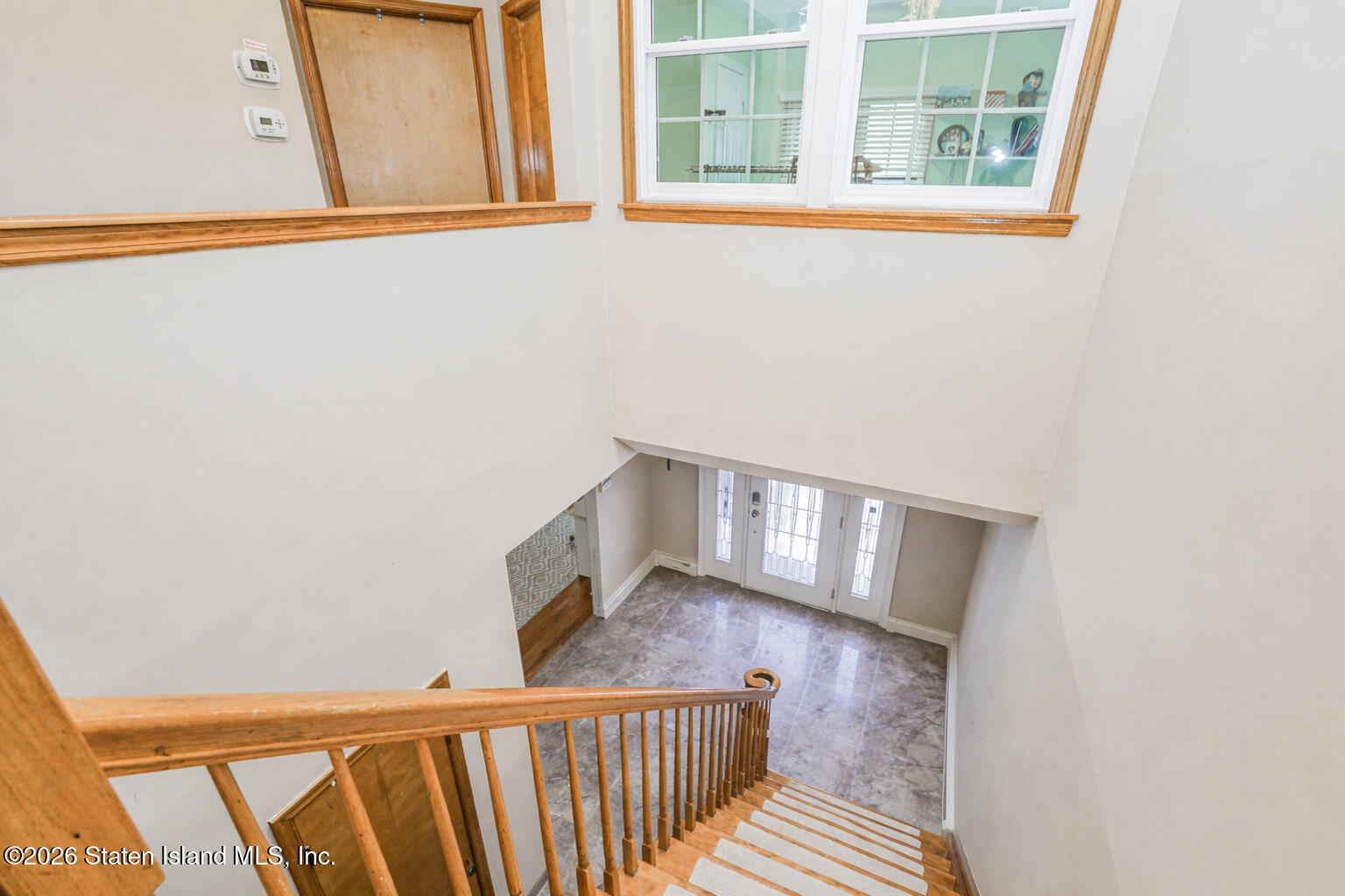 471 Main Street Staten Island, NY 10307 - Photo 19 of 39 a view of a hallway with wooden floor and staircase