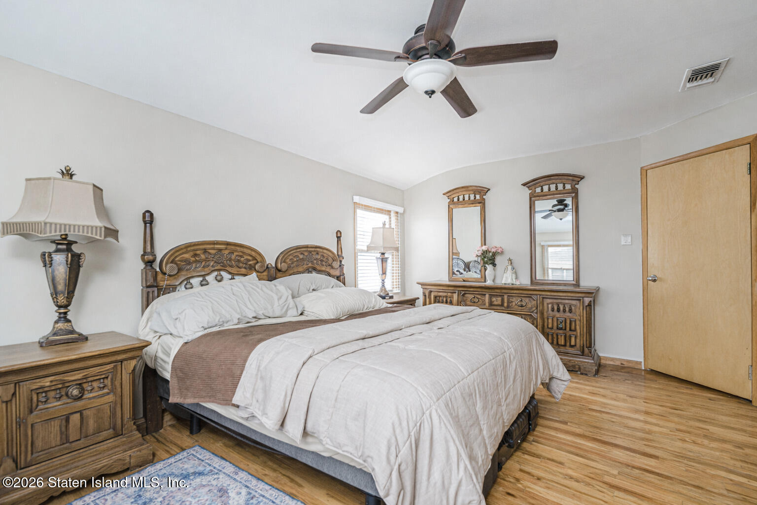 471 Main Street Staten Island, NY 10307 - Photo 22 of 39 a bedroom with a bed and wooden floor