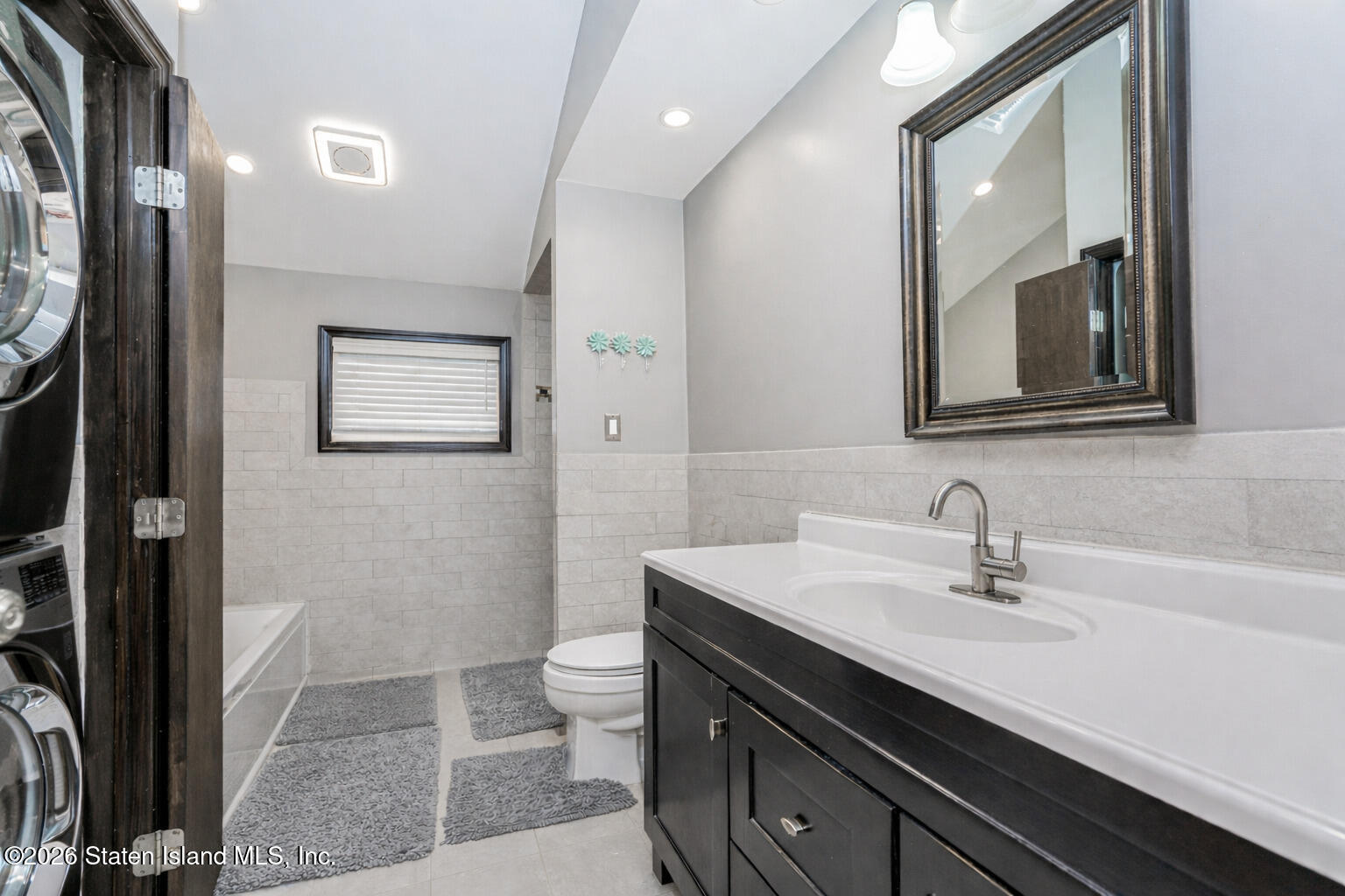 471 Main Street Staten Island, NY 10307 - Photo 26 of 39 a bathroom with a sink a toilet and shower