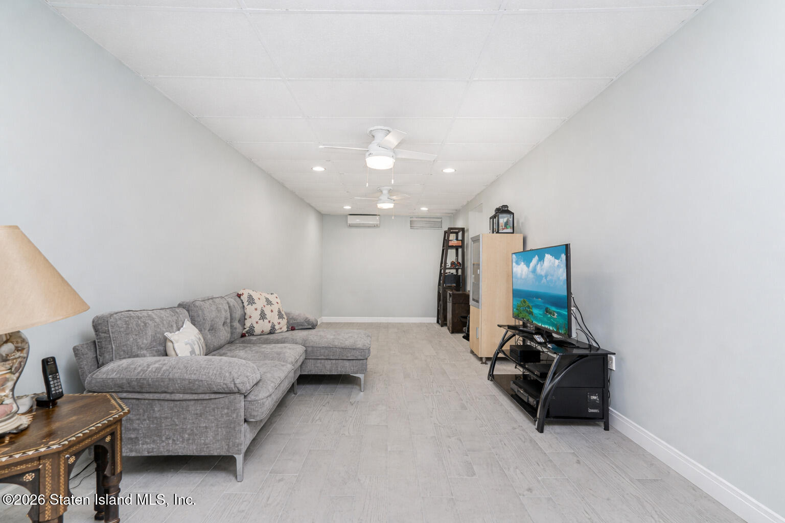 471 Main Street Staten Island, NY 10307 - Photo 29 of 39 a living room with furniture and a chandelier