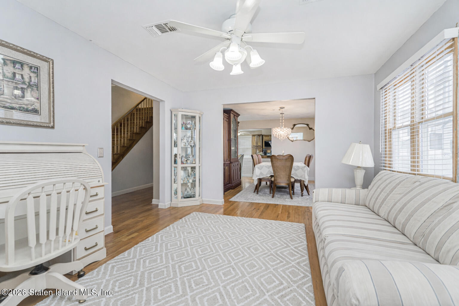 471 Main Street Staten Island, NY 10307 - Photo 6 of 39 a living room with furniture a chandelier and a flat screen tv
