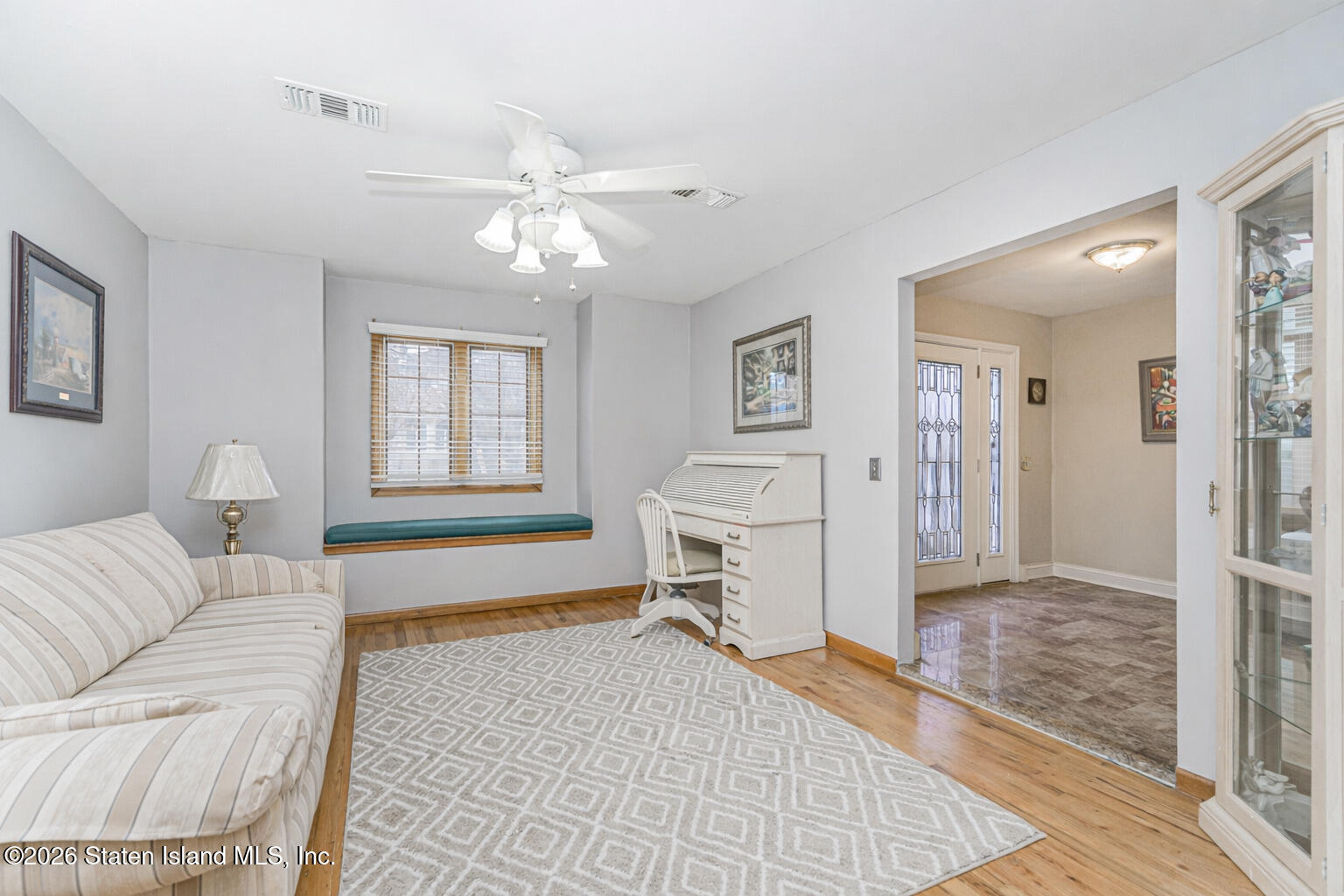 471 Main Street Staten Island, NY 10307 - Photo 7 of 39 a living room with furniture a window and a chandelier
