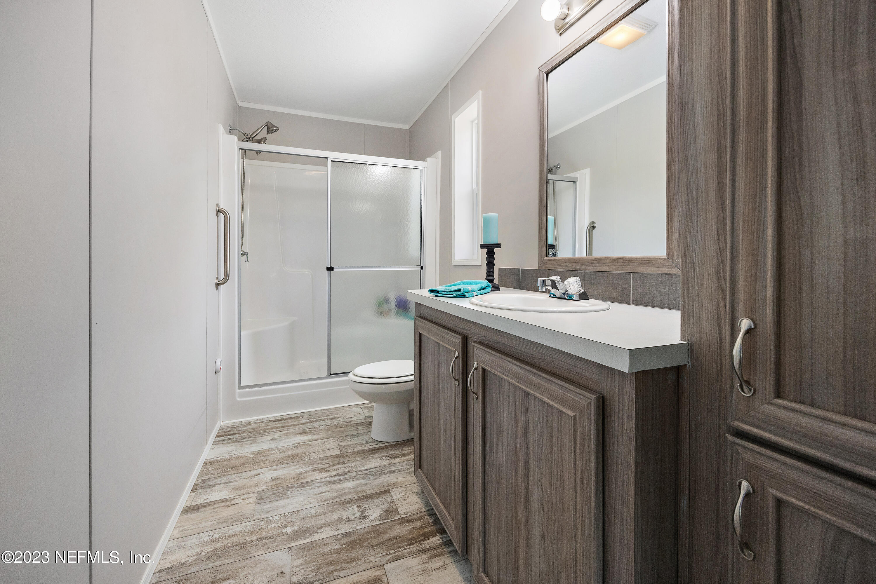 117 Riverside Avenue Satsuma, FL 32189 - Photo 12 of 24 a bathroom with a sink a toilet and shower