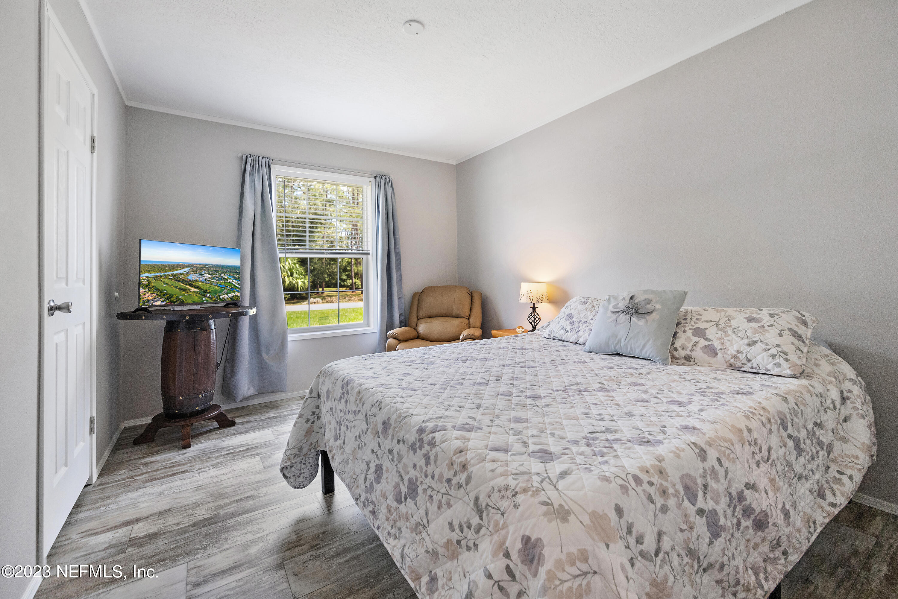 117 Riverside Avenue Satsuma, FL 32189 - Photo 14 of 24 a bedroom with a bed and a window